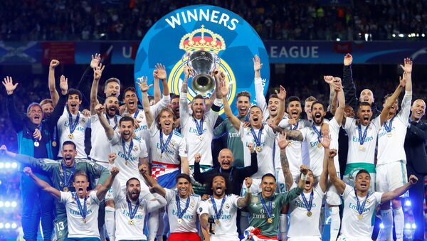 Soccer Football - Champions League Final - Real Madrid v Liverpool - NSC Olympic Stadium, Kiev, Ukraine - May 26, 2018 Real Madrid celebrate winning the Champions League with the trophy - Sputnik International
