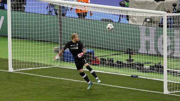 Liverpool goalkeeper Loris Karius looks at the ball after Real Madrid's Gareth Bale scored his side's 3rd goal during the Champions League Final soccer match between Real Madrid and Liverpool at the Olimpiyskiy Stadium in Kiev, Ukraine, Saturday, May 26, 2018 - Sputnik International