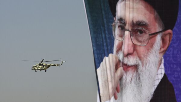 A police helicopter flies behind a poster of Iranian supreme leader Ayatollah Ali Khamenei - Sputnik International