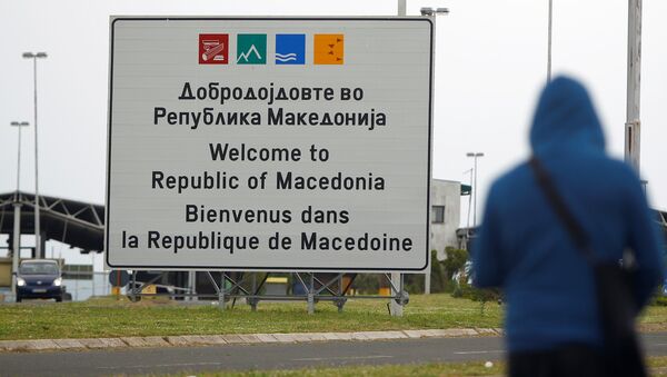 A person walks near a sign that reads welcome to Macedonia at the Macedonia-Greece border April 16, 2018 - Sputnik International