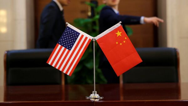 Chinese and U.S. flags are set up for a signing ceremony during a visit by U.S. Secretary of Transportation Elaine Chao at China's Ministry of Transport in Beijing, China April 27, 2018 - Sputnik International