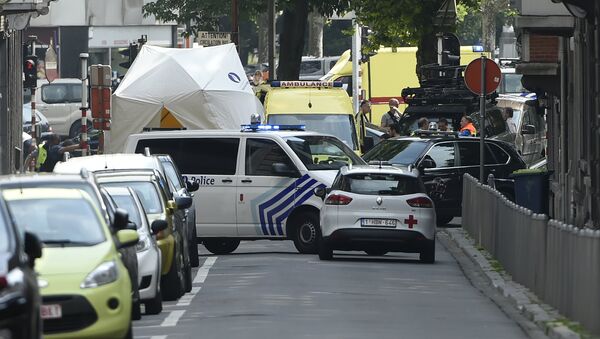 Police and ambulance are seen at the site where an armed man shot and killed police officers before being subdued by police in the eastern Belgian city of Liege on May 29, 2018 - Sputnik International