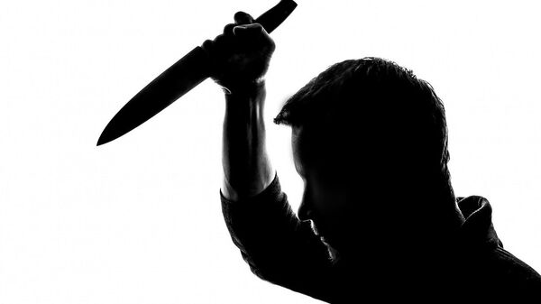A silhouette of a man holding a knife - Sputnik International