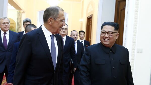 Russian Foreign Minister Sergei Lavrov, left, and North Korean leader Kim Jong Un meet in Pyongyang - Sputnik International