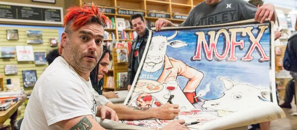 NOFX singer “Fat Mike” Burkett poses as he prepares to sign a fan's poster at a book signing at Parnassus Books in Nashville, Tenn. NOFX singer “Fat Mike” Burkett poses as he prepares to sign a fan's poster at a book signing at Parnassus Books in Nashville, Tenn. - Sputnik International