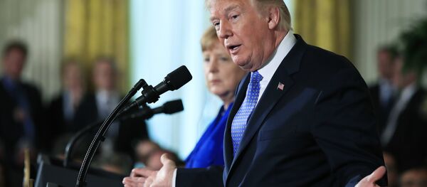 President Donald Trump with German Chancellor Angela Merkel speaks during a news conference in the East Room of the White House in Washington, Friday, April 27, 2018 - Sputnik International