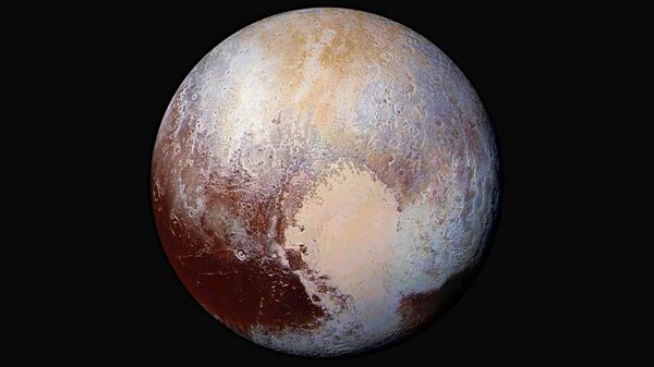 The planet Pluto is pictured in a handout image made up of four images from New Horizons' Long Range Reconnaissance Imager (LORRI) taken in July 2015 combined with color data from the Ralph instrument to create this enhanced color global view - Sputnik International