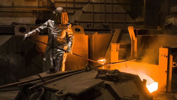 An employee in protective clothing takes a sample from the furnace at the steel producer, Salzgitter AG, in Salzgitter, Germany, Thursday, March 22, 2018 - Sputnik International