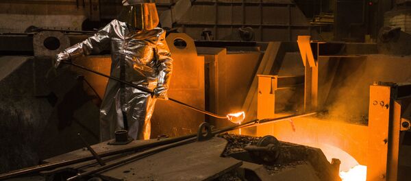 An employee in protective clothing takes a sample from the furnace at the steel producer, Salzgitter AG, in Salzgitter, Germany, Thursday, March 22, 2018 - Sputnik International