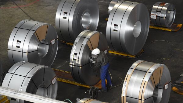 FILES) In this file photo taken on March 17, 2015 a worker packs coils for delivery at the production site of a German steel company in Salzgitter. Imposed stiff tariffs by the United States on European, Mexican and Canadian steel and aluminium, that have come into effect on June 1, 2018 - Sputnik International