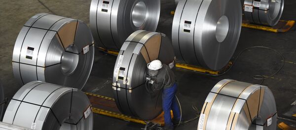 FILES) In this file photo taken on March 17, 2015 a worker packs coils for delivery at the production site of a German steel company in Salzgitter. Imposed stiff tariffs by the United States on European, Mexican and Canadian steel and aluminium, that have come into effect on June 1, 2018 - Sputnik International