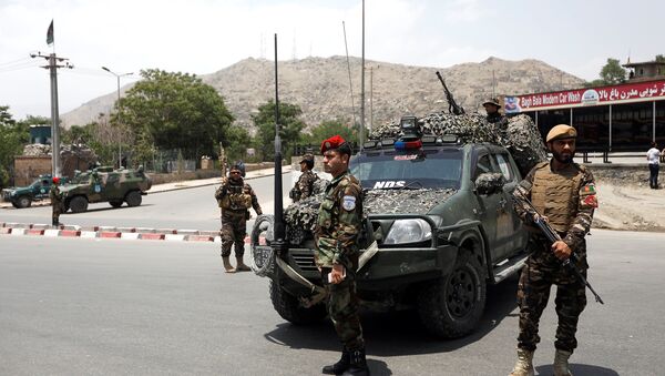 Afghan security forces keep watch at the site of a suicide attack in Kabul, Afghanistan June 4, 2018 - Sputnik International