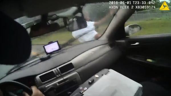 Bodycam footage shows an officer with Georgia's Athens-Clarke County Police Department ram a suspect with his police cruiser. - Sputnik International