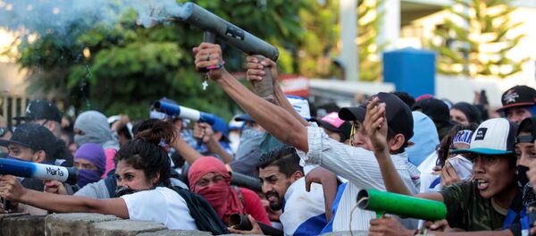 Demonstrators fire a homemade mortar during a protest against Nicaragua's President Demonstrators fire a homemade mortar during a protest against Nicaragua's President - Sputnik International