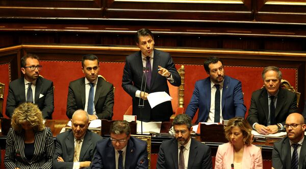 Newly appointed Italian Prime Minister Giuseppe Conte speaks next to Interior Minister Matteo Salvini, Minister of Labor and Industry Luigi Di Maio, Minister of Justice Alfonso Bonafede and Foreign Minister Enzo Moavero Milanesi during his first session at the Senate in Rome, Italy, June 5, 2018 Newly appointed Italian Prime Minister Giuseppe Conte speaks next to Interior Minister Matteo Salvini, Minister of Labor and Industry Luigi Di Maio, Minister of Justice Alfonso Bonafede and Foreign Minister Enzo Moavero Milanesi during his first session at the Senate in Rome, Italy, June 5, 2018 - Sputnik International