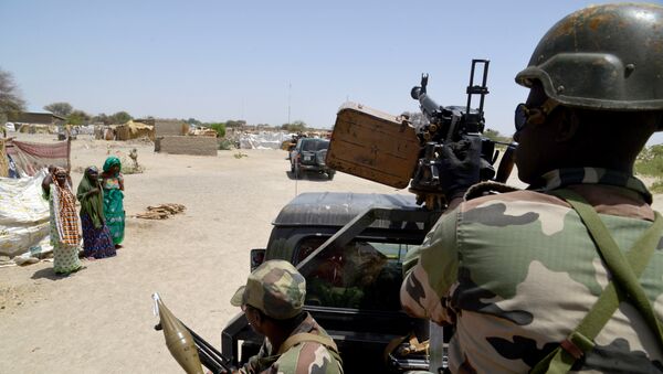 (File) A photo taken on May 25, 2015 shows Nigerien soldiers patroling on a road between Diffa and Bosso - Sputnik International
