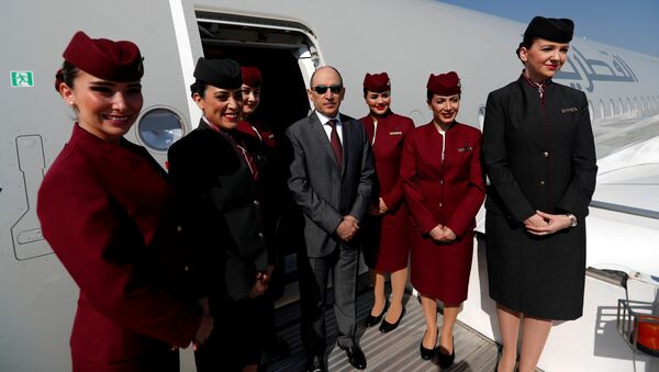 Qatar Airways Chief Executive Officer Akbar al-Baker poses with cabin crew in an Airbus A350-1000 at the Eurasia Airshow in the Mediterranean resort city of Antalya, Turkey April 25, 2018 - Sputnik International