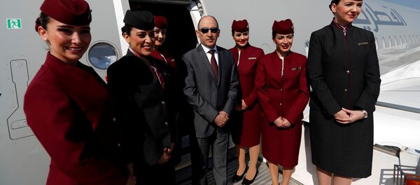 Qatar Airways Chief Executive Officer Akbar al-Baker poses with cabin crew in an Airbus A350-1000 at the Eurasia Airshow in the Mediterranean resort city of Antalya, Turkey April 25, 2018 Qatar Airways Chief Executive Officer Akbar al-Baker poses with cabin crew in an Airbus A350-1000 at the Eurasia Airshow in the Mediterranean resort city of Antalya, Turkey April 25, 2018 - Sputnik International