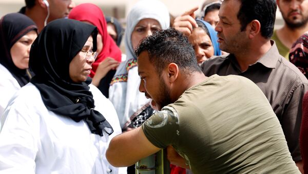 A relative of Tunisian migrants, who drowned when their boat sank, reacts as he leaves a hospital morgue after identifying the bodies of his family members, in Sfax, Tunisia June 4, 2018 - Sputnik International