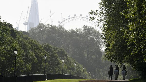(File) Members of the Household Cavalry are seen, with the London Eye wheel and Shard skyscraper behind, riding in the early morning in Hyde Park in London, Britain, May 11, 2018 - Sputnik International