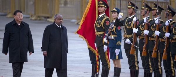 Djibouti's President Ismail Omar Guelleh, second from left walks with Chinese President Xi Jinping during a welcome ceremony held outside the Great Hall of the People in Beijing. - Sputnik International