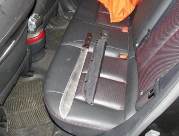 A machete and its sheath, found in the back of a Nissan in which the gang were traveling in west London A machete and its sheath, found in the back of a Nissan in which the gang were traveling in west London - Sputnik International