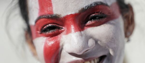 An English soccer fan smiles as she enters the Velodrome stadium ahead of the Euro 2016 Group B soccer match between England and Russia, in Marseille, France, Saturday, June 11, 2016. An English soccer fan smiles as she enters the Velodrome stadium ahead of the Euro 2016 Group B soccer match between England and Russia, in Marseille, France, Saturday, June 11, 2016. - Sputnik International