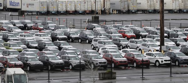 New cars and cargo containers are shown in a staging area, Friday, April 6, 2018, at the Port of Tacoma in Tacoma, Wash. New cars and cargo containers are shown in a staging area, Friday, April 6, 2018, at the Port of Tacoma in Tacoma, Wash. - Sputnik International
