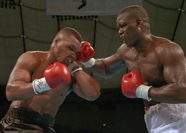 James Buster Douglas (right) caused a huge upset when he beat Mike Tyson in 1990 James Buster Douglas (right) caused a huge upset when he beat Mike Tyson in 1990 - Sputnik International