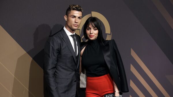 In this March 19, 2018 file photo, Real Madrid player Cristiano Ronaldo and his girlfriend Georgina Rodriguez pose for photos as they arrive for the Portuguese soccer federation awards ceremony in Lisbon - Sputnik International