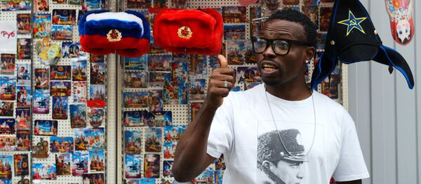 A man near a spot selling souvenirs on Moscow's oldest street, Nikolskaya A man near a spot selling souvenirs on Moscow's oldest street, Nikolskaya - Sputnik International