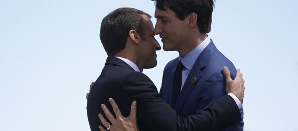 France's President Macron hugs Canada's Prime Minister Trudeau as he arrives at the G7 Summit in Charlevoix France's President Macron hugs Canada's Prime Minister Trudeau as he arrives at the G7 Summit in Charlevoix - Sputnik International