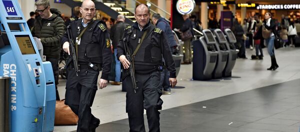 Armed police is seen on patrol as police and airport's own security personnel have increased patrols at Copenhagen Airport, Denmark March 22 2016 Armed police is seen on patrol as police and airport's own security personnel have increased patrols at Copenhagen Airport, Denmark March 22 2016 - Sputnik International