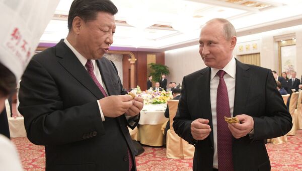 President Vladimir Putin and Chinese President Xi Jinping at a reception in Tianjin. - Sputnik International