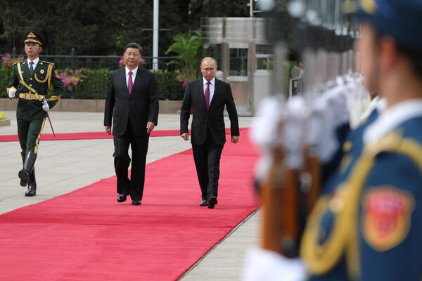 Presidents Vladimir Putin and Xi Jinping during their meeting in Beijing - Sputnik International
