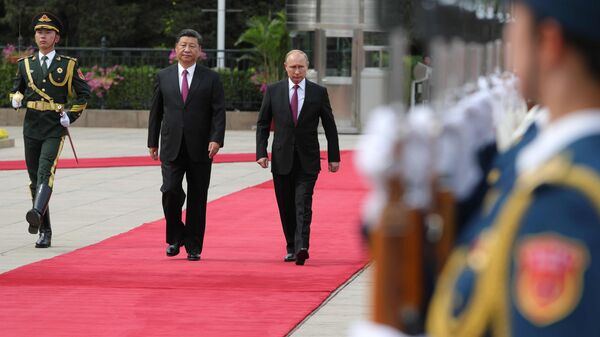 Presidents Putin and Xi during their meeting in Beijing. - Sputnik International