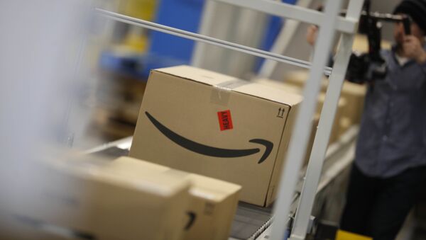Boxes move down a conveyor belt at an Amazon fulfillment center - Sputnik International