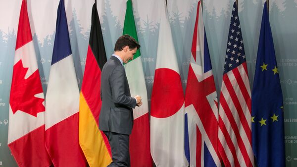 Canada's Prime Minister Justin Trudeau leaves a press conference at the G7 Summit in the Charlevoix town of La Malbaie, Quebec - Sputnik International