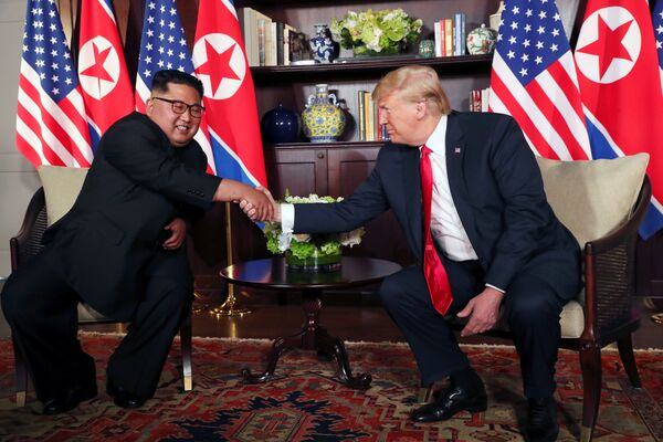 U.S. President Donald Trump shakes hands with North Korea's leader Kim Jong Un before their bilateral meeting at the Capella Hotel on Sentosa island in Singapore June 12, 2018. U.S. President Donald Trump shakes hands with North Korea's leader Kim Jong Un before their bilateral meeting at the Capella Hotel on Sentosa island in Singapore June 12, 2018. - Sputnik International