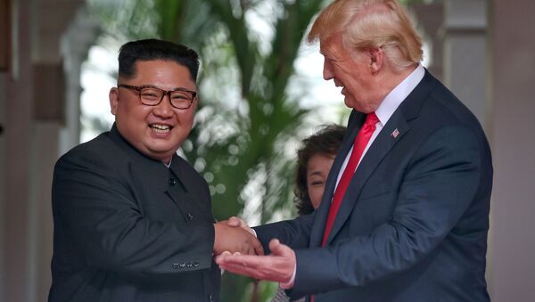 U.S. President Donald Trump meets North Korean leader Kim Jong Un at the Capella Hotel on Sentosa island in Singapore June 12, 2018. - Sputnik International