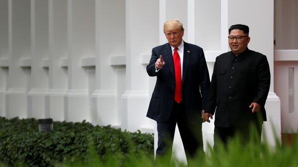 U.S. President Donald Trump and North Korean leader Kim Jong Un walk after lunch at the Capella Hotel on Sentosa island in Singapore June 12, 2018. - Sputnik International