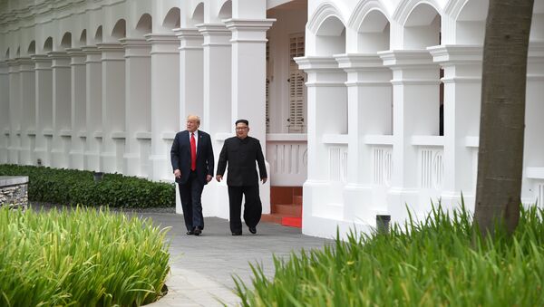 U.S. President Donald Trump and North Korean leader Kim Jong Un walk in the Capella Hotel after their working lunch, on Sentosa island in Singapore June 12, 2018 - Sputnik International