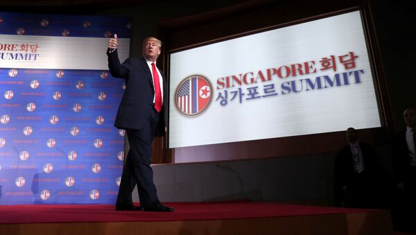 U.S. President Donald Trump gestures after a news conference after his meeting with North Korean leader Kim Jong Un at the Capella Hotel on Sentosa island in Singapore June 12, 2018 - Sputnik International