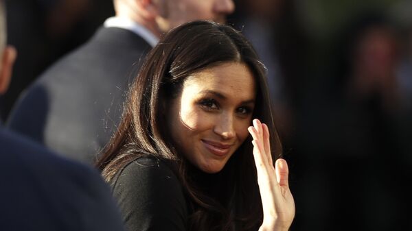 Meghan Markle waves as she leaves with Prince Harry after watching a hip hop opera performance by young people involved in the Full Effect programme at the Nottingham Academy school in Nottingham, England, Friday Dec. 1, 2017 - Sputnik International