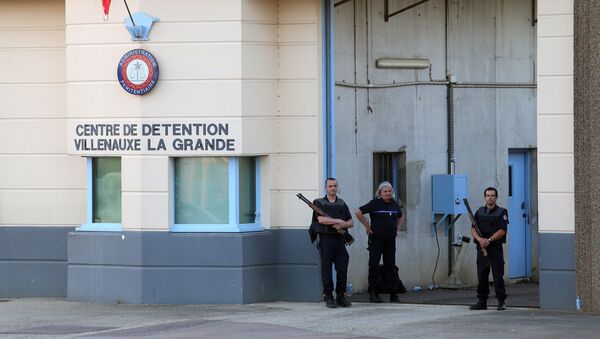 In this file photo taken on June 14, 2017 police stand at the entrance of the prison of Villenauxe-la-Grande, eastern France, where a prison guard was taken hostage by an inmate - Sputnik International