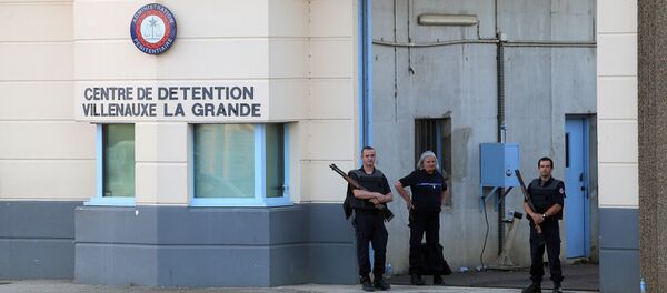 In this file photo taken on June 14, 2017 police stand at the entrance of the prison of Villenauxe-la-Grande, eastern France, where a prison guard was taken hostage by an inmate - Sputnik International