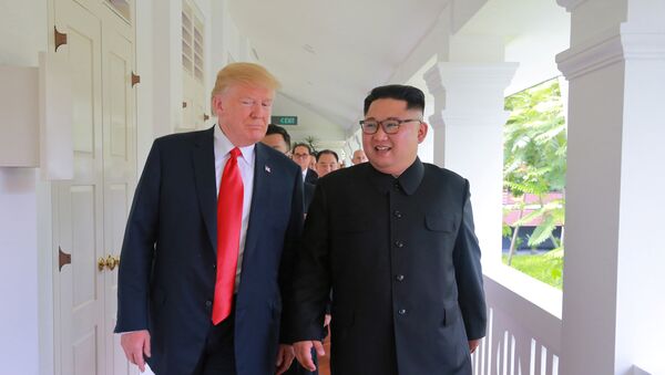 U.S. President Donald Trump walks with North Korean leader Kim Jong Un at the Capella Hotel on Sentosa island in Singapore in this picture released on June 12, 2018 by North Korea's Korean Central News Agency - Sputnik International
