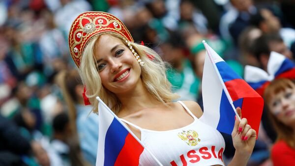 Soccer Football - World Cup - Group A - Russia vs Saudi Arabia - Luzhniki Stadium, Moscow, Russia - June 14, 2018 Russia fan before the matc - Sputnik International