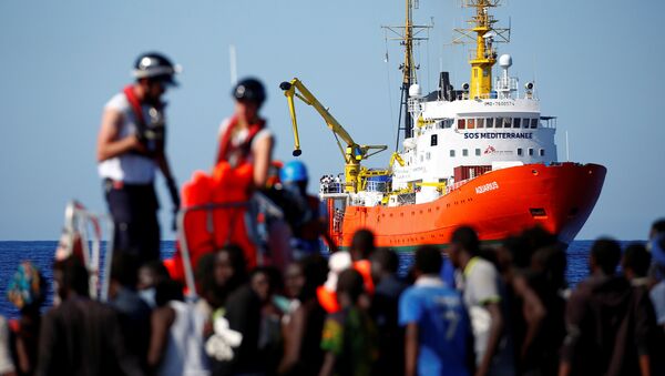 The MV Aquarius rescue ship is seen as migrants on are rescued by the SOS Mediterranee organisation during a search and rescue (SAR) operation in the Mediterranean Sea, off the Libyan Coast, September 14, 2017 - Sputnik International