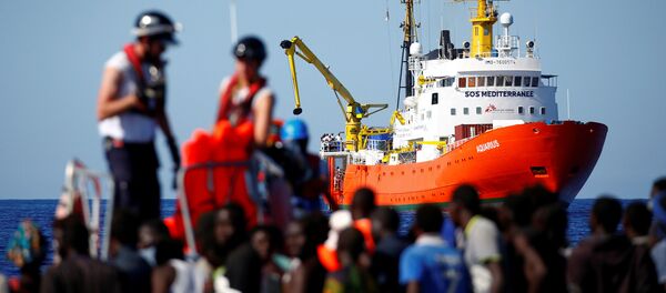 The MV Aquarius rescue ship is seen as migrants on are rescued by the SOS Mediterranee organisation during a search and rescue (SAR) operation in the Mediterranean Sea, off the Libyan Coast, September 14, 2017 - Sputnik International